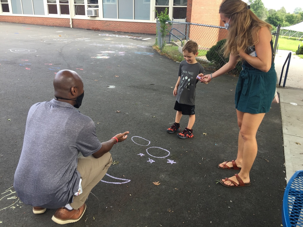 principal chalk drawing with student